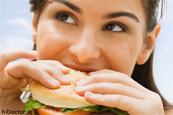 20140202091718ch-Teenage-girl-eating-a-hamburger-692189