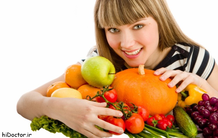 Young beautiful women with fruit and vegetables.