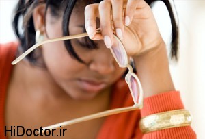 photolibrary_rf_photo_of_woman_removing_glasses