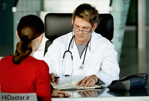 getty_rf_photo_of_woman_at_doctors_desk