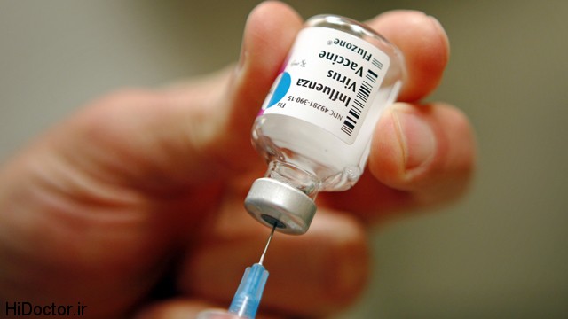 A nurse prepares an injection of the influenza vaccine at Massachusetts General Hospital in Boston, Massachusetts