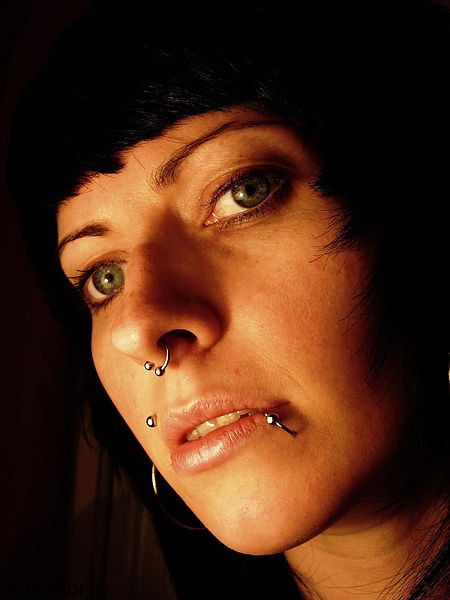 Portrait_of_dark_haired_girl_with_beautiful_eyes_and_several_piercings