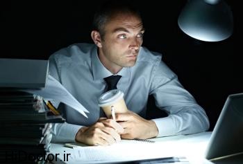 Businessman working in office overnight