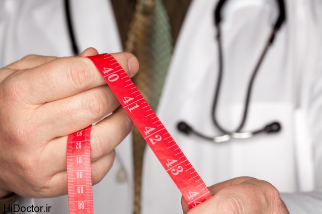 Doctor with Stethoscope Holding Red Measuring Tape.