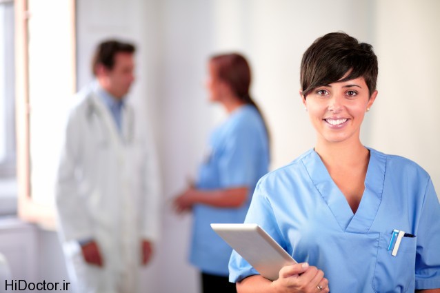 Lovely latin nurse on blue uniform standing