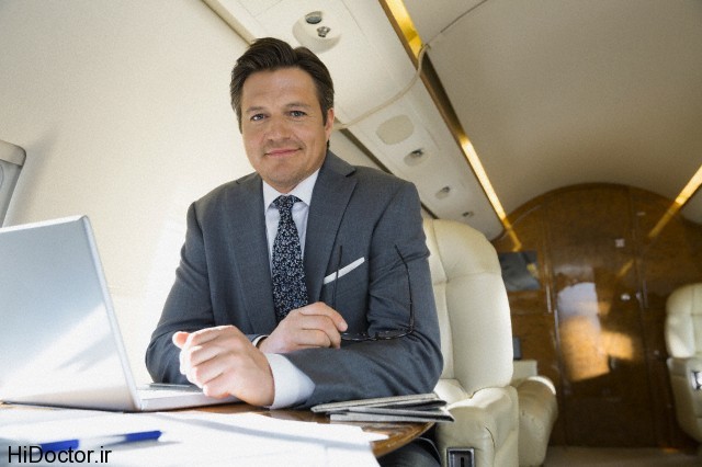 Portrait of businessman working on corporate jet