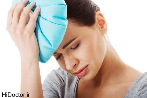 woman-having-headache-and-holding-ice-bag