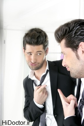Handsome man humor funny gesture in a mirror