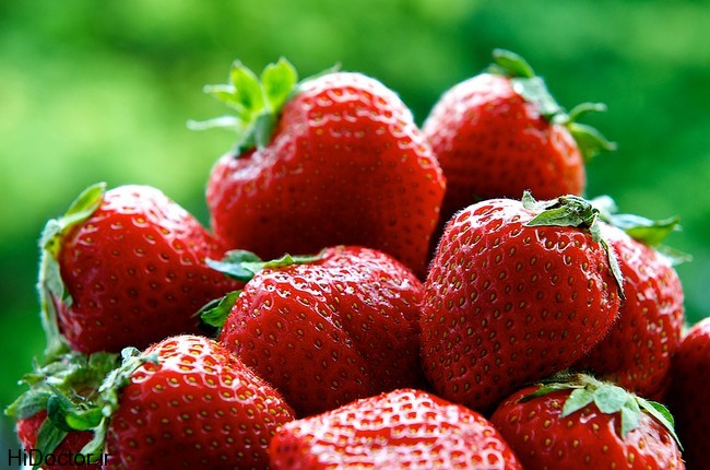 Fresh strawberries on summer with green background, strawberries