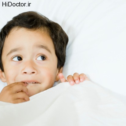 Boy Lying in Bed