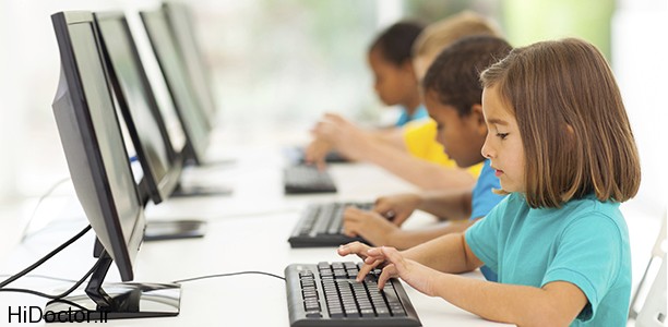 group elementary school students in computer class
