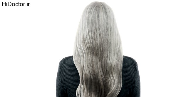 Mature woman with long, gray hair from her back.