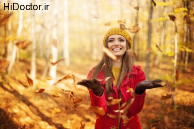 Happy-Woman-Throwing-Leaves