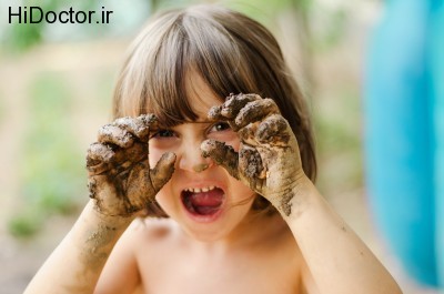 bigstock-Happy-girl-playing-with-mud-wi-50397080