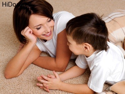Smiling young mother has a good time in conversations with the son of preschool age