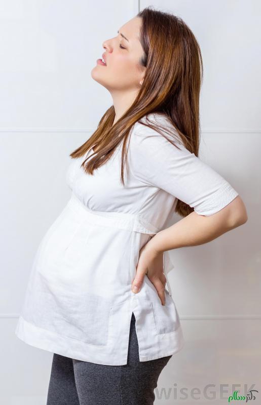 pregnant-woman-in-white-with-back-pain