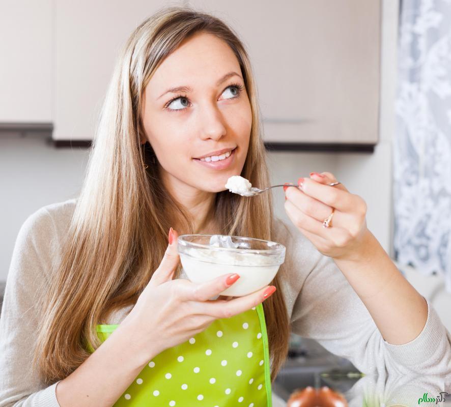 woman-eating-yogurt-from-bowl