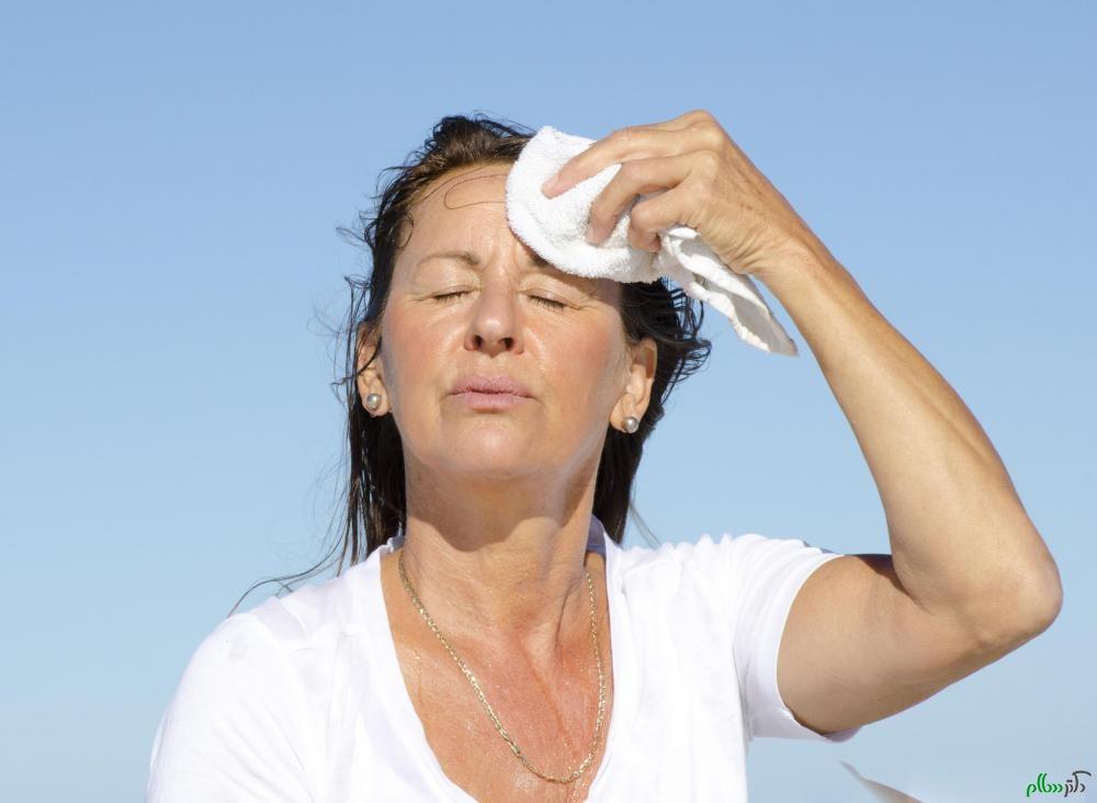 middle-aged-woman-drying-sweaty-forehead
