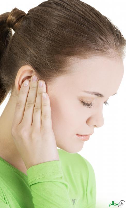 woman-in-green-shirt-with-ear-pain