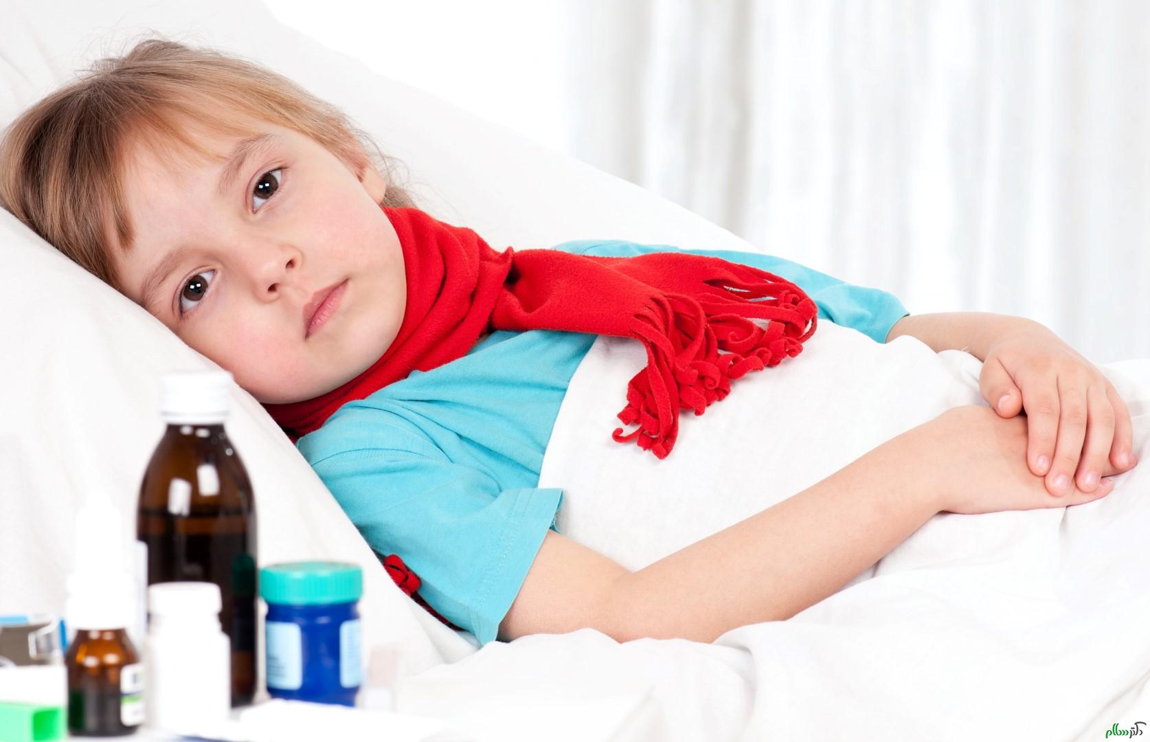 Sick little beautiful girl with red scarf in the bed