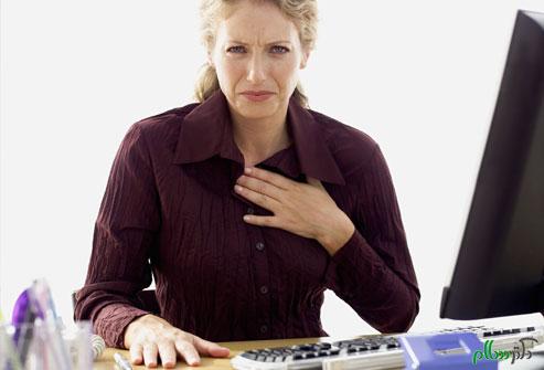getty_rf_photo_of_woman_with_heartburn_at_work