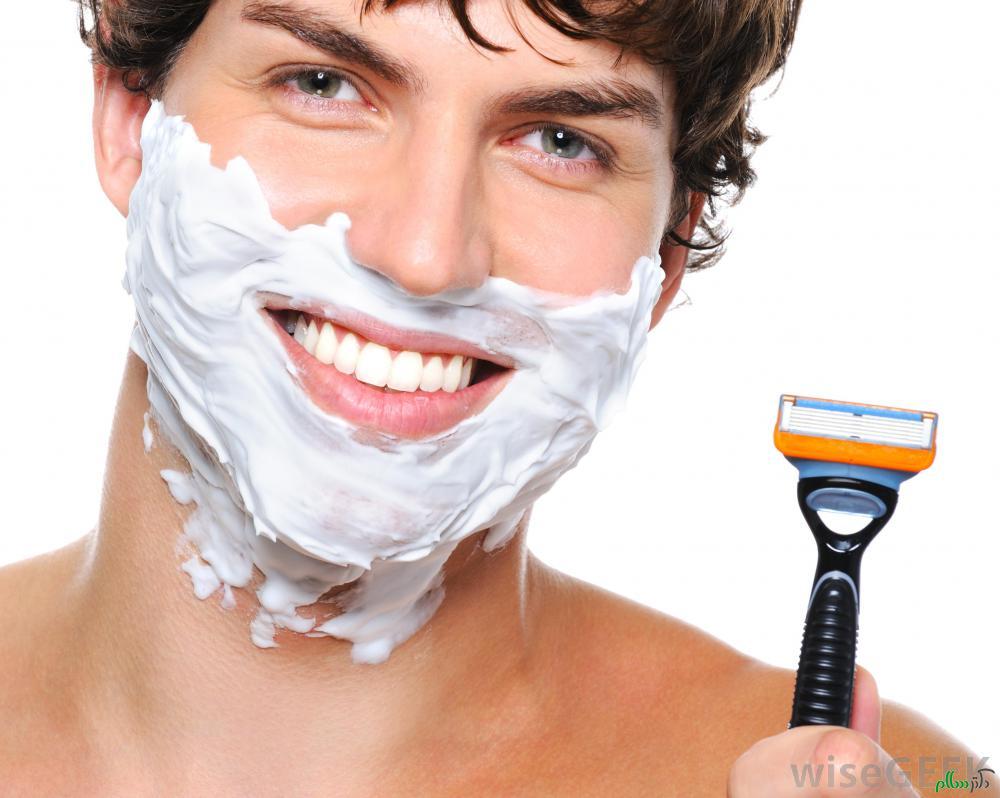 man-with-shaving-cream-on-face-holding-razor