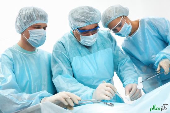 Three surgeons operating on a patient