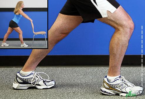 webmd_photo_of_trainer_doing_calf_stretch