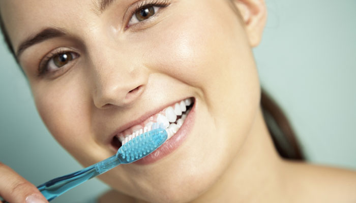 463376-brushing-teeth