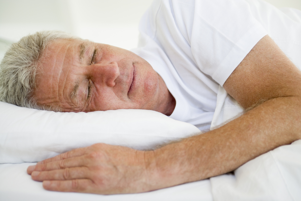 man-lying-in-bed-sleeping