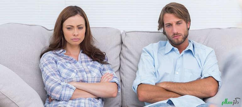 Upset couple sit on a sofa with arms crossed during a psychotherapy; Shutterstock ID 139499255; PO: aol; Job: production; Client: drone
