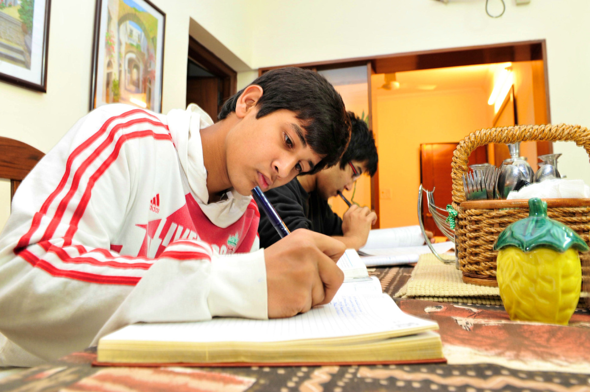 In India, competition for university spots is fierce and students are under so much stress that some schools have removed ceiling fans so students can't hang themselves. Shashwat Misra, 15, and his brother Samarth, 18, study in their New Delhi home.  //Rick Westhead